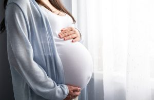 pregnant person's stomach for Tylenol During Pregnancy and Autism blog post