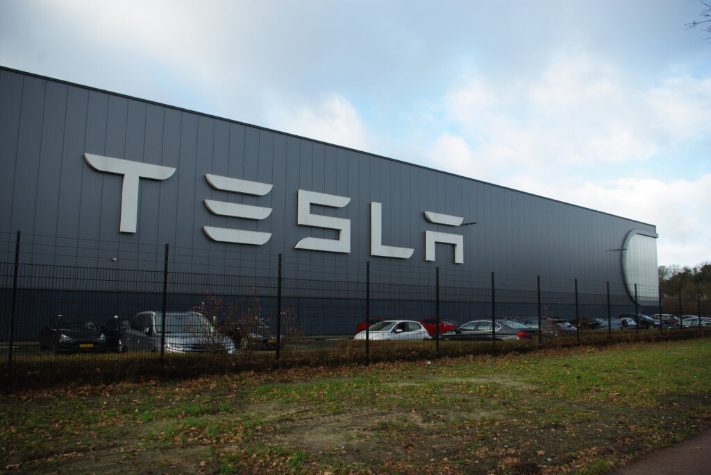 image of Tesla sign on building for Tesla's Autopilot blog post