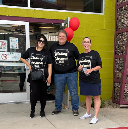 volunteers pose at A New Leaf outreach event in Surprise, AZ