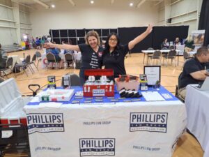 Phillips Law Group staff members Jackie Velez and Sharon Mews at Avondale Project Connect event