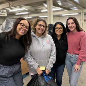 community outreach for the holidays - four volunteers pictured