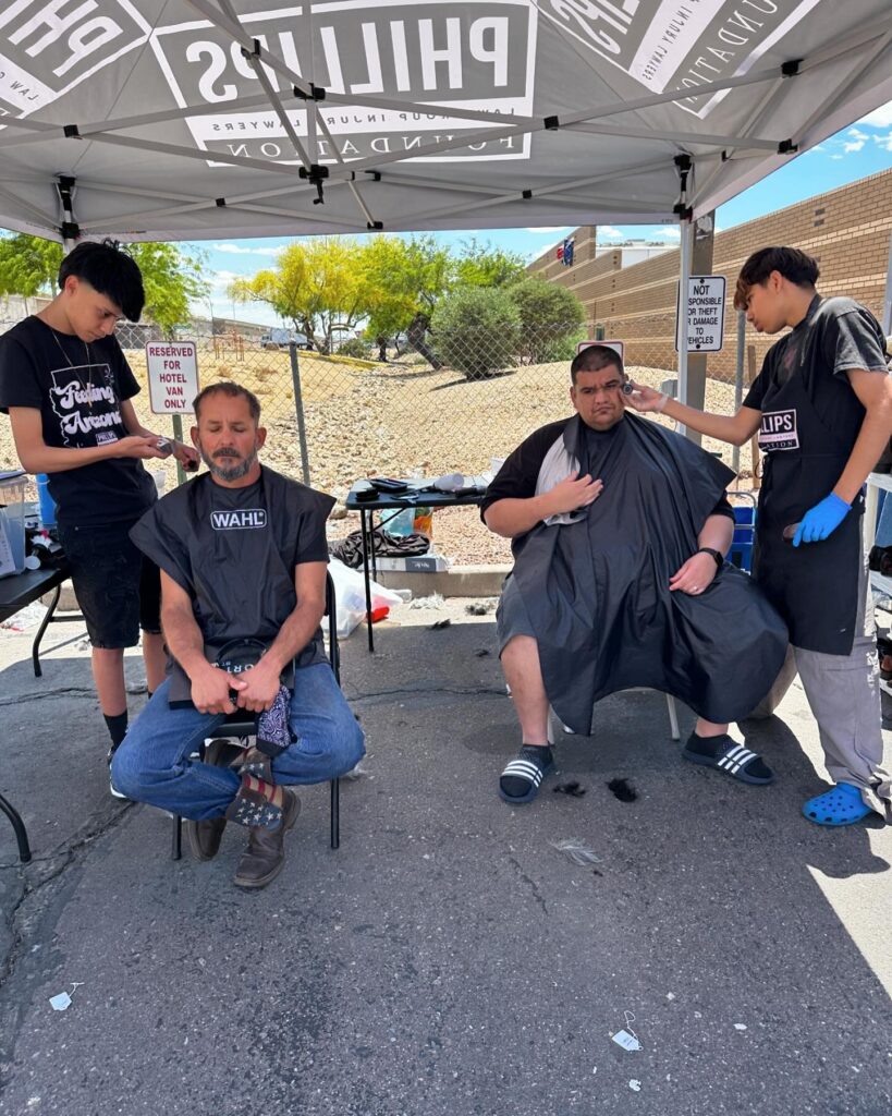 individuals getting haircuts at event