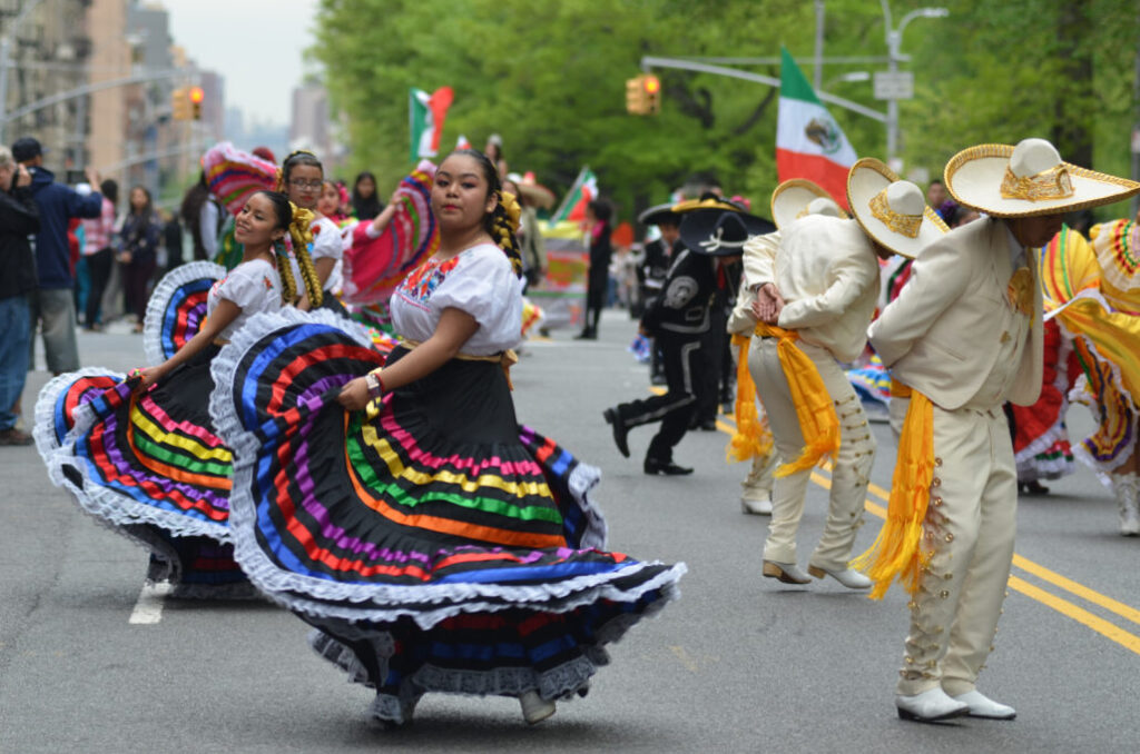Participants at the annual Cinco de Mayo Parade in New York City for history of cinco de mayo blog post