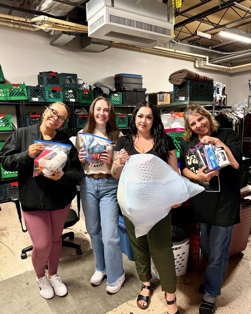 four volunteers at MANA House