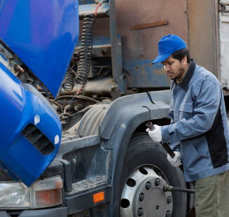 man changing a truck wheel