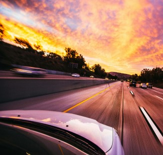 front of a car in motion on a road