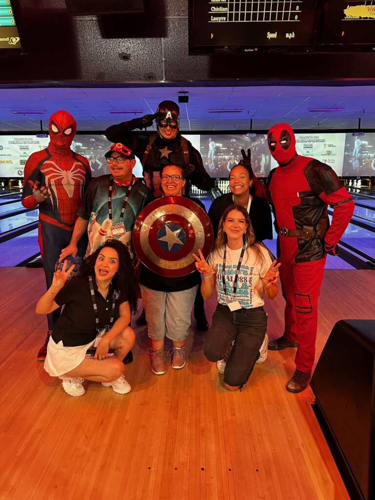 group photo of volunteers and participants from Special Olympics Arizona Bowl-A-Thon event