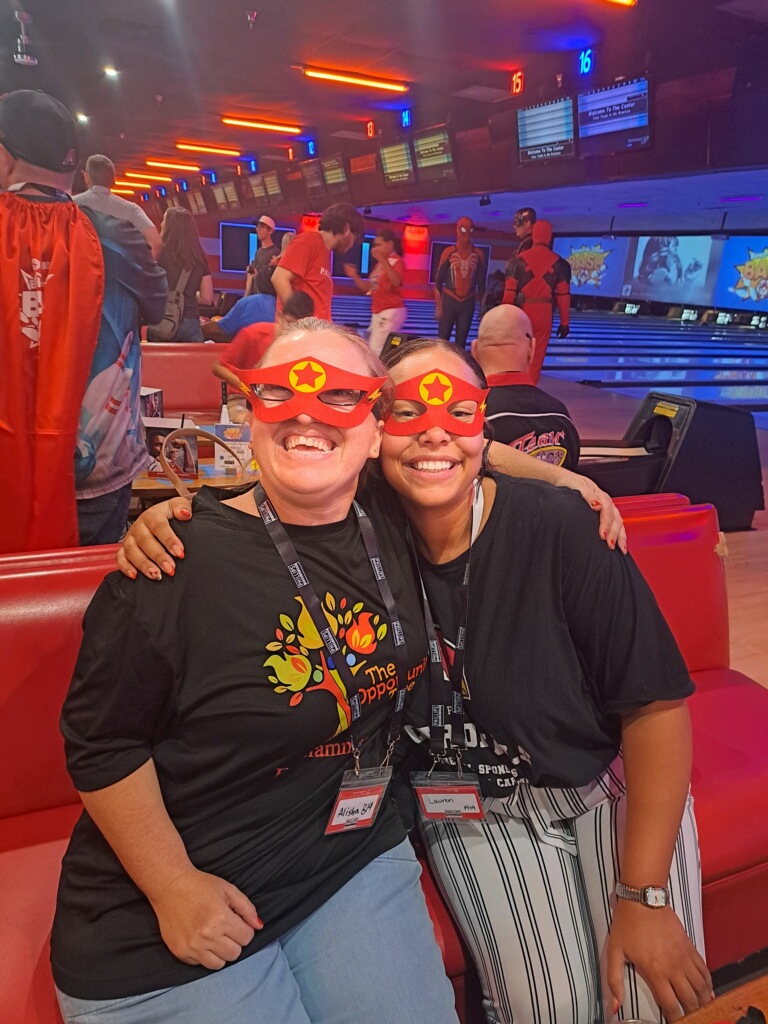 volunteer and participant at special olympics bowling event