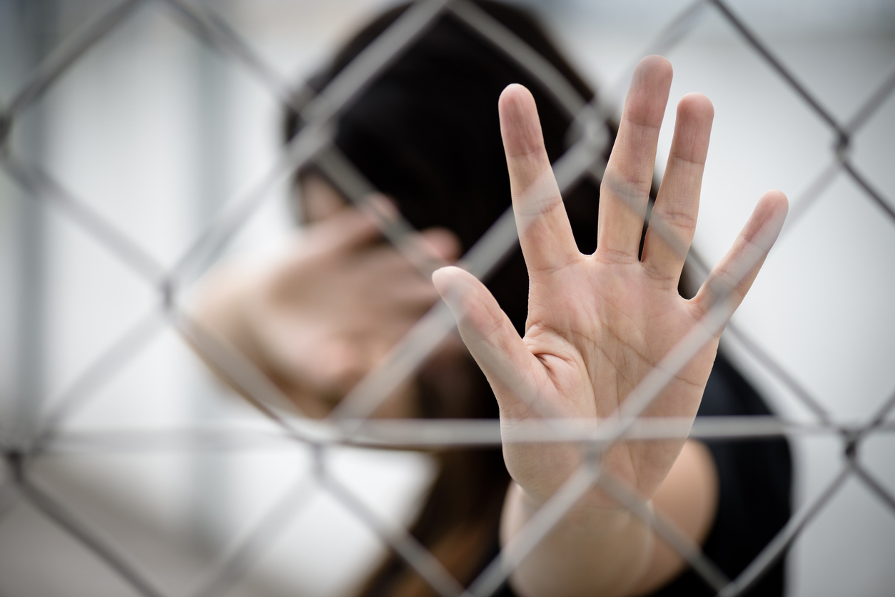 Woman hand close her face and another hand sign for stop abusing violence