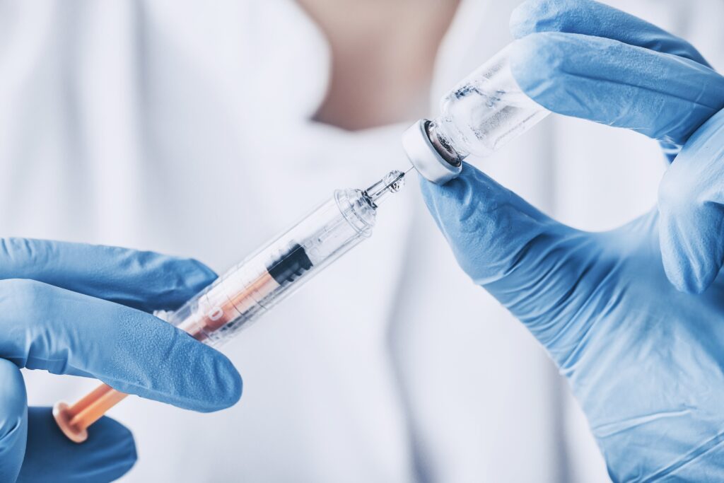 image of vaccine being drawn from bottle