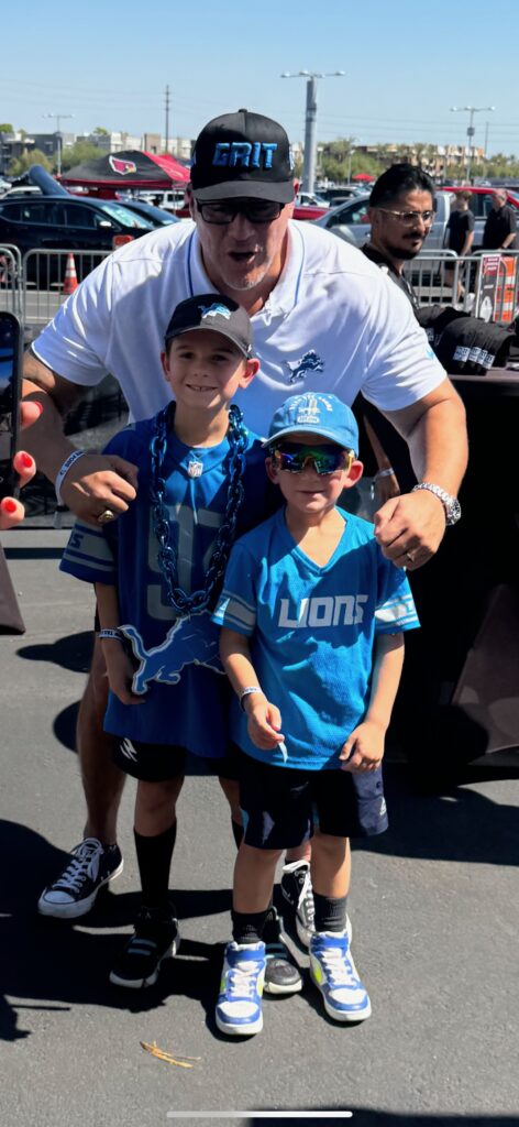juan roque with detroit lions fans at football game