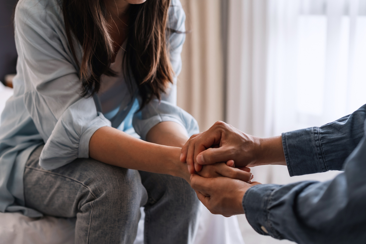 man holding a woman hands