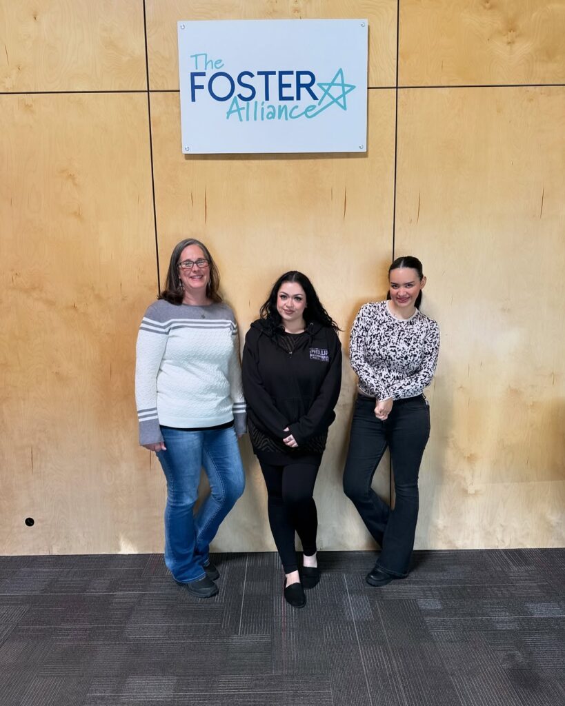 three volunteers at foster alliance for november community service blog post