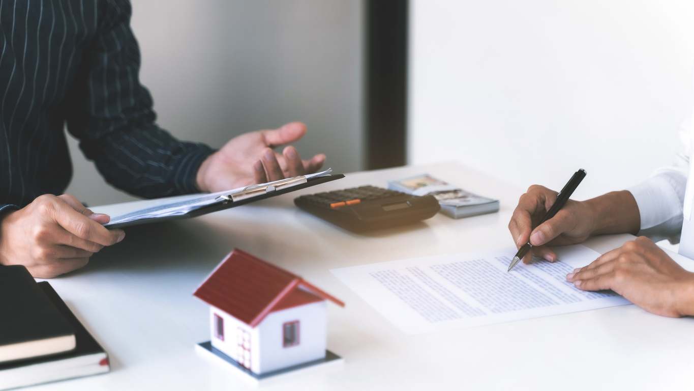 Concept of Property, Real estate agent with customer rent or buy house with contract.