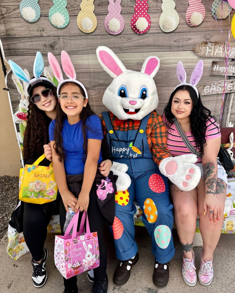 people with the easter bunny at maggie's place easter egg hunt event