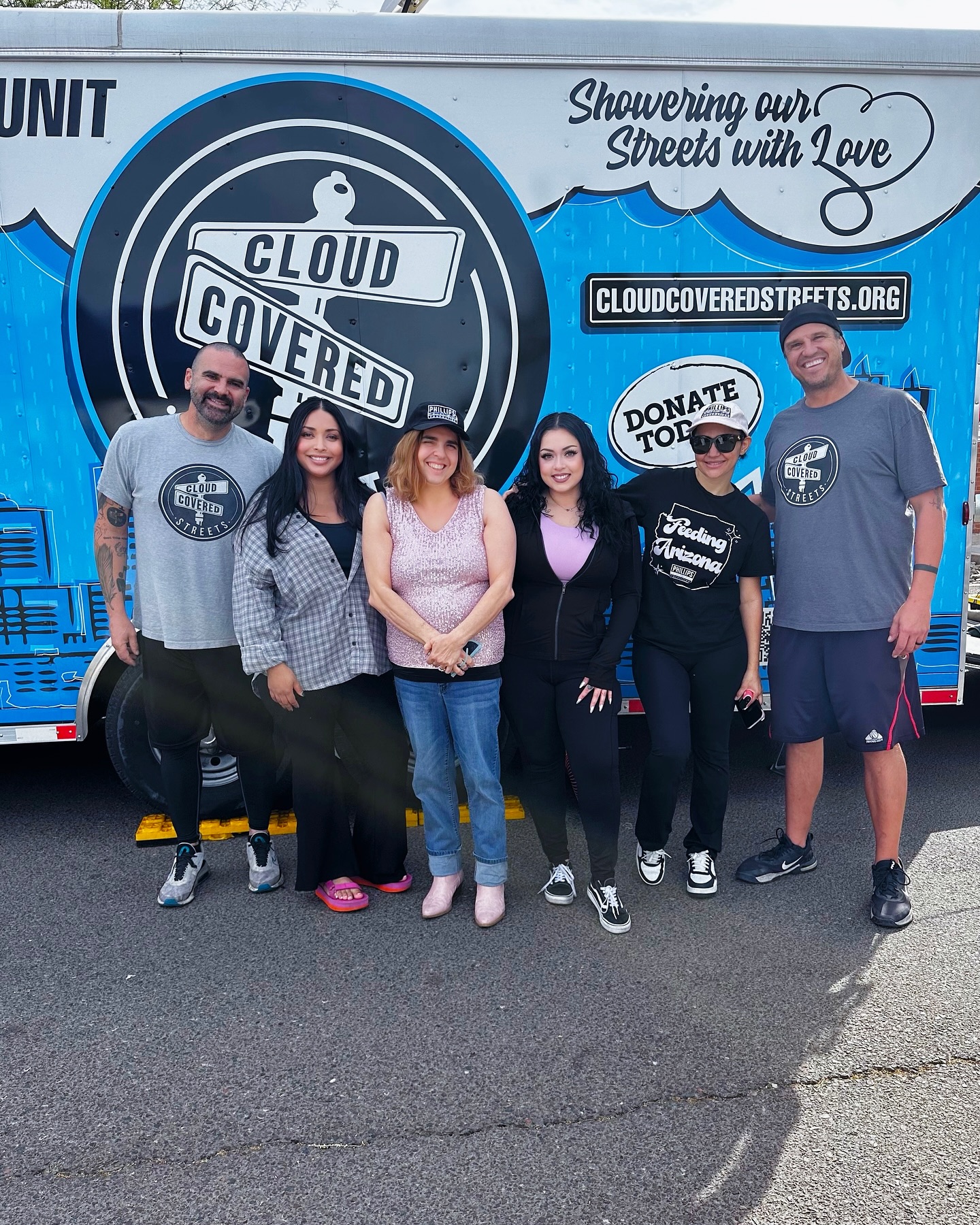 image of volunteers in front of cloud covered streets van for march 2025 community service events blog post