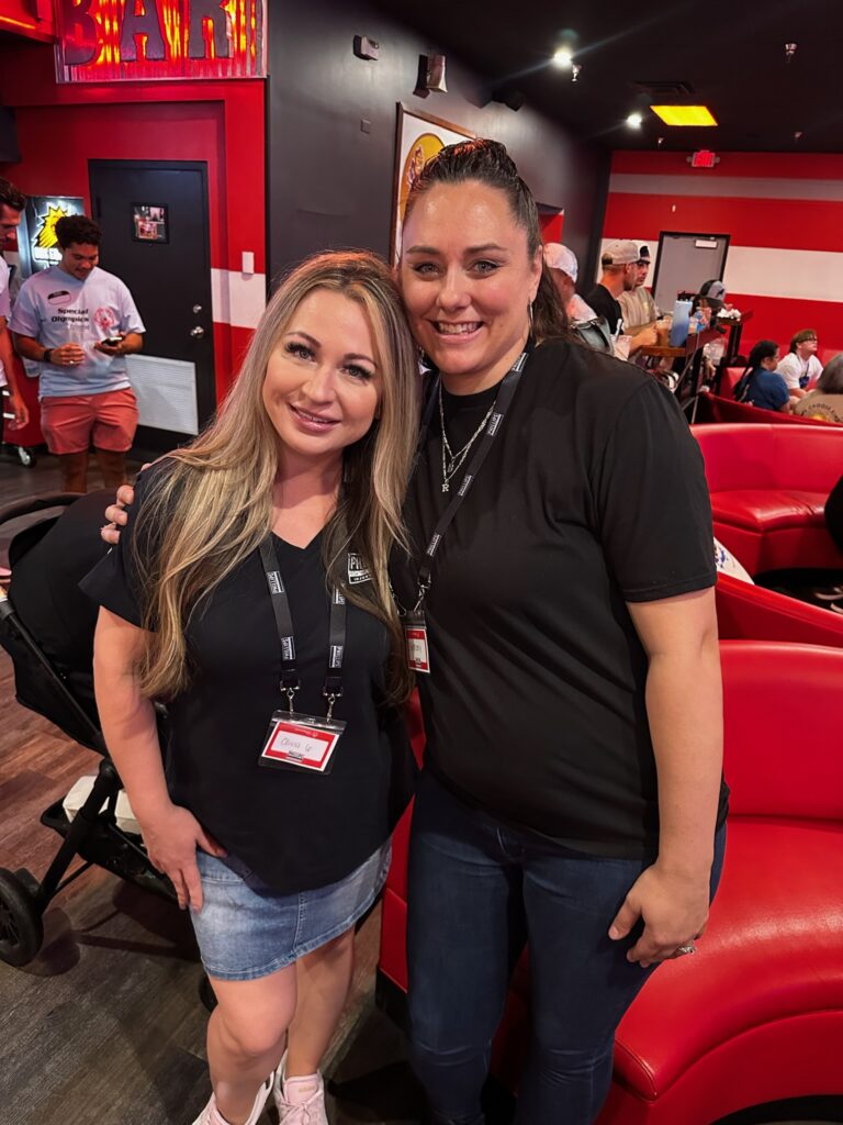 two women smile and pose at Special Olympics Bowl-A-Thon Bash 2025