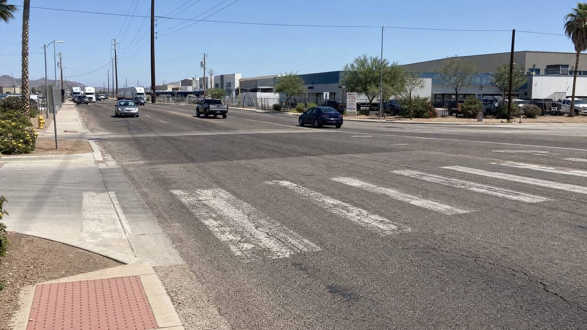 Faded crosswalk on industrial road in Tolleson Arizona