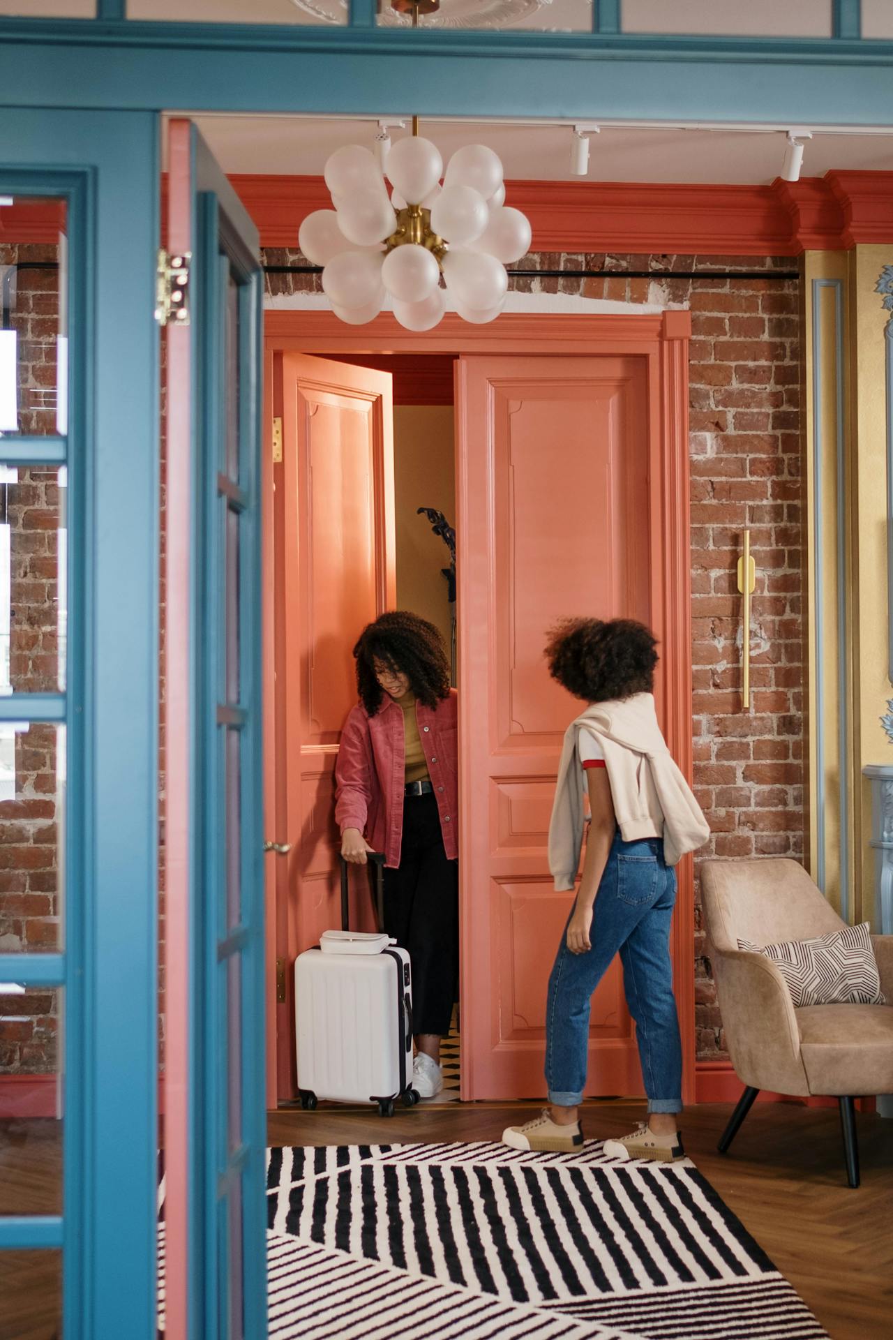 people checking in to rental with luggage