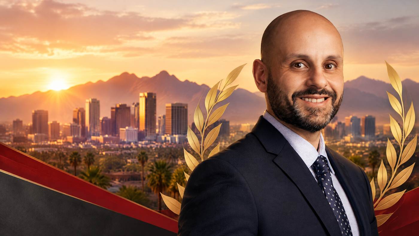 Nasser Abujbarah in a warm Phoenix community-leadership recognition scene with a refined gold champion laurel and skyline