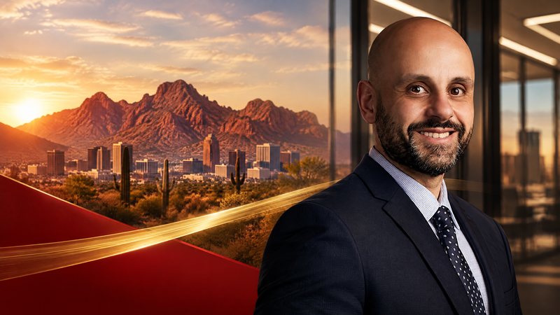 Premium Arizona business recognition graphic with a red-rock desert horizon, contemporary office-light geometry and a forward-motion gold ribbon in Phillips Law Group red, charcoal and warm neutral tones; no people and no readable text.