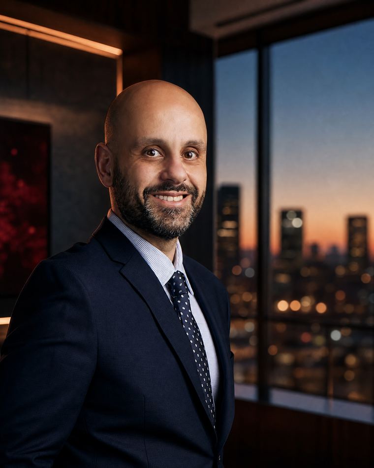 Nasser Abujbarah in a Phoenix law-office portrait for his 2026 Champions of Change Business Leader of the Year recognition