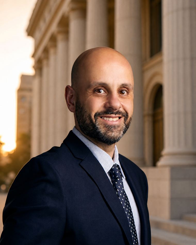 Nasser Abujbarah in a professional Arizona courthouse portrait for the 2025 Arizona Top 100 Lawyers recognition