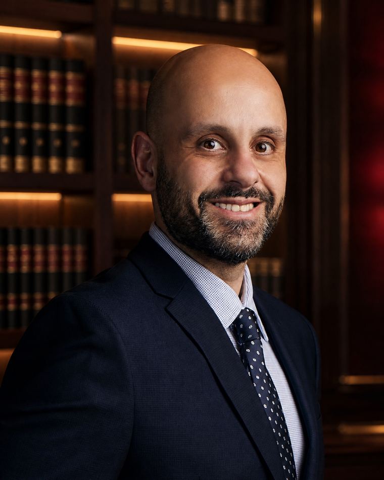 Nasser Abujbarah in a professional legal-library portrait for the 2026 Arizona Top 100 Lawyers recognition