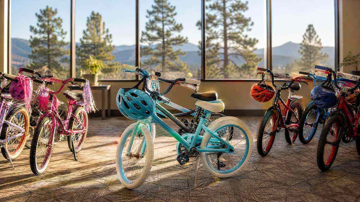 New bicycles and safety helmets prepared for foster youth at a Flagstaff community event