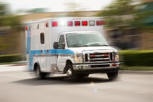 blurred daytime photo of ambulance enroute