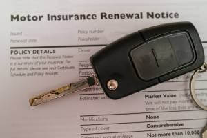 keys on top of insurance renewal notice