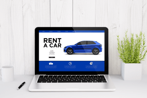 website for renting a car on a laptop on a desk