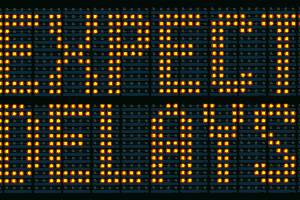 expect delays on road sign with lights