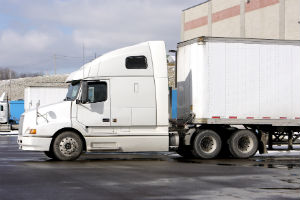 white semi truck in loading dock